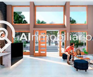 Fotografía del hall de acceso moderno del edificio en David Arellano, comuna de Independencia